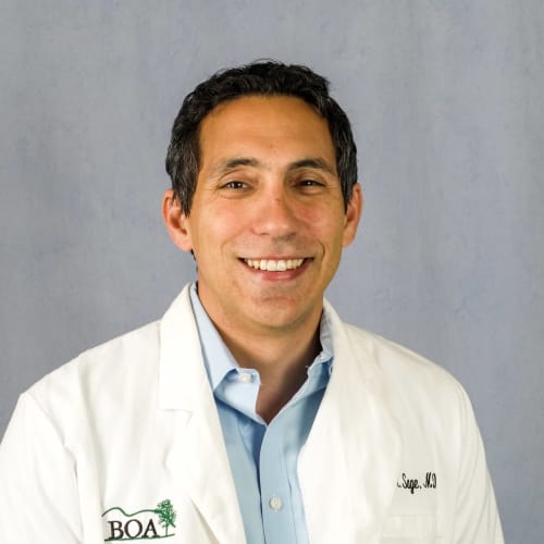A photograph of Daniel Sage, MD