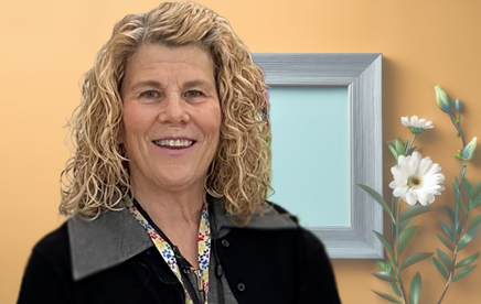 Smiling social worker in office setting.